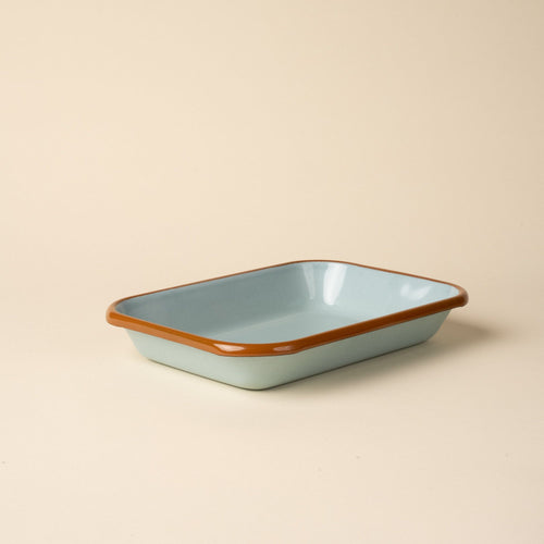 Medium rectangular baking dish in a robin's egg blue color with a warm brown rim.