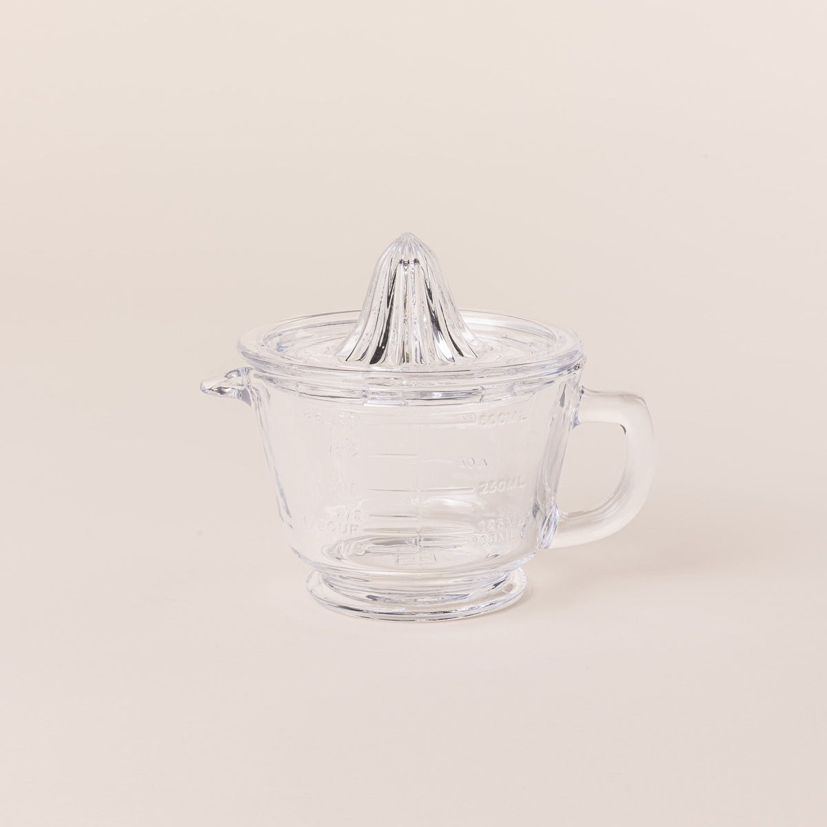 Traditional glass juicer with a handle and removable top