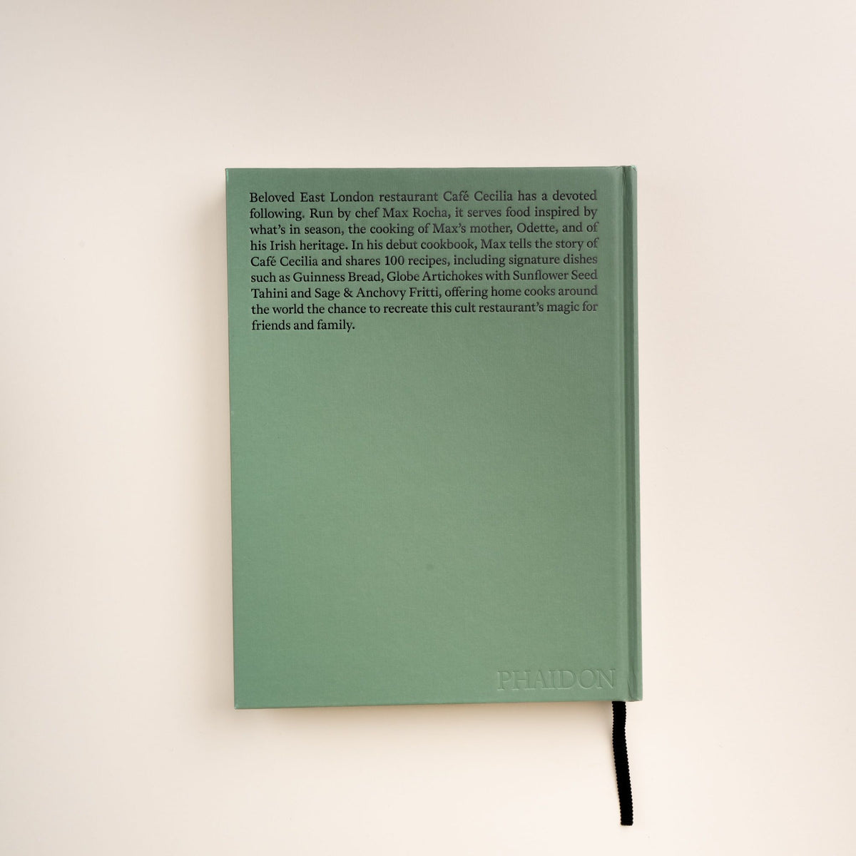 Back cover of Cafe Cecilia Cookbook by Max Rocha with text about the restaurant, recipes, and embossed Phaidon logo.