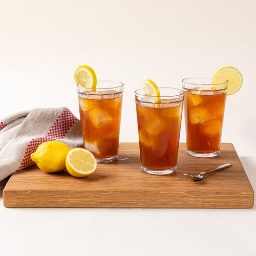 3 diner-style glass that tapers to be wider at the top in a tall size and filled with iced tea