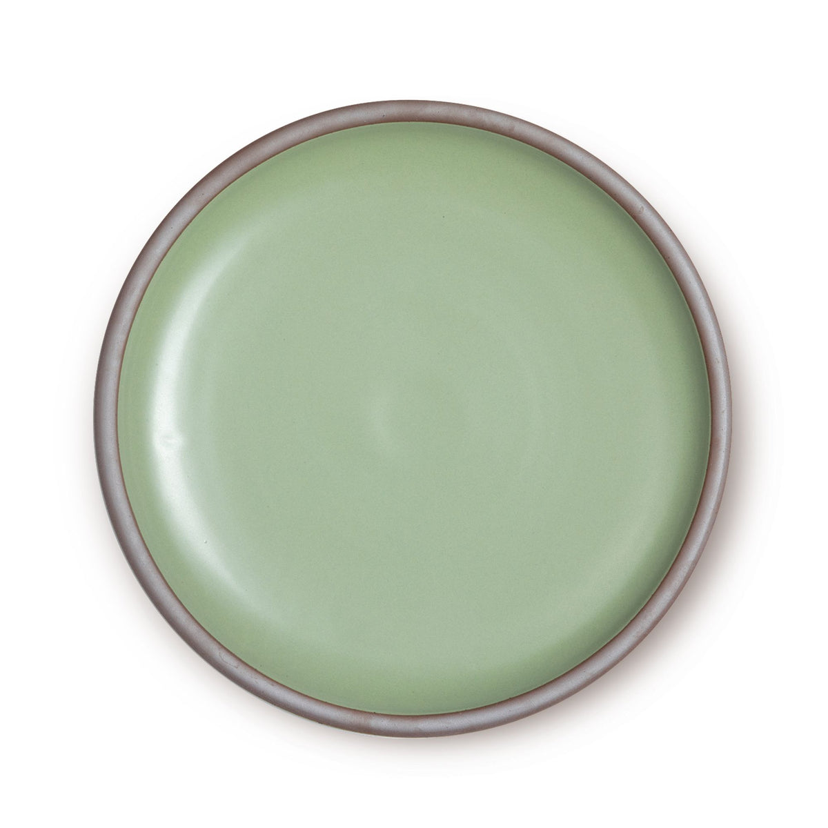 A large ceramic platter in a calming sage green color featuring an unglazed rim.