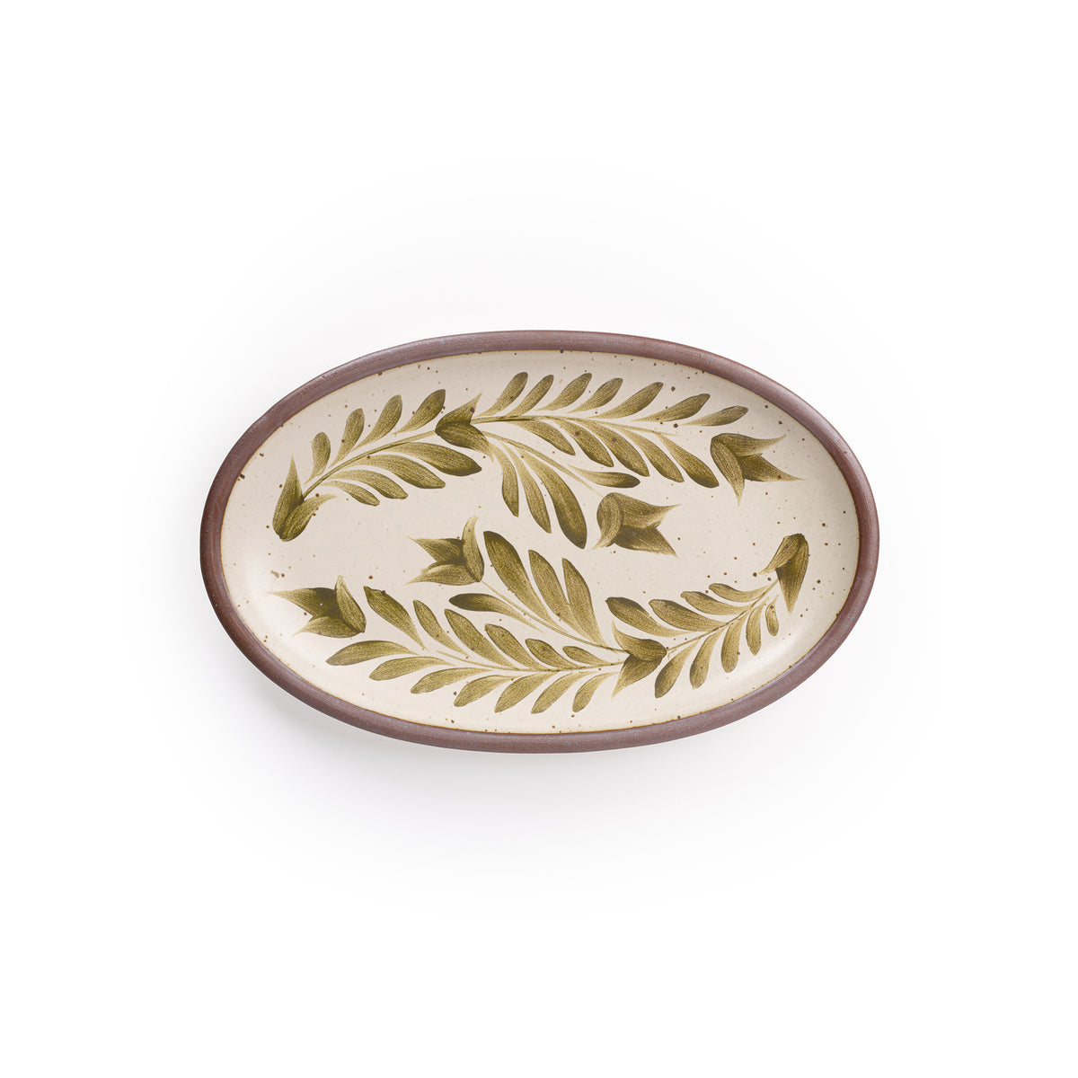 A medium oval ceramic platter in a warm, tan-toned, off-white color featuring iron speckles and an unglazed rim, with handpainted greenery in an olive green color.