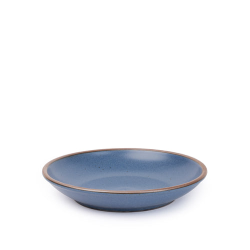 A medium ceramic plate with a curved bowl edge in a toned-down navy color featuring iron speckles and an unglazed rim.