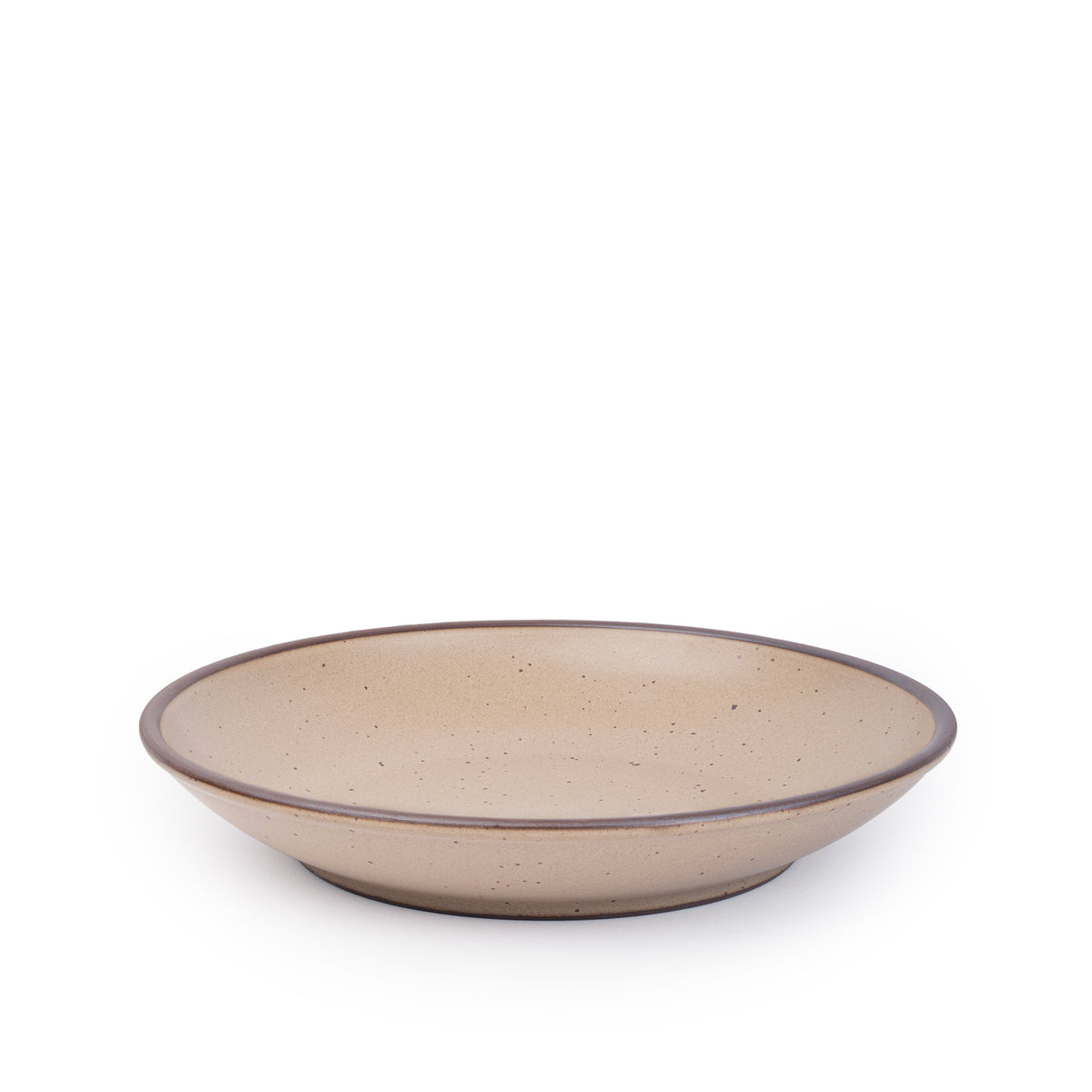 A large ceramic plate with a curved bowl edge in a warm pale brown color featuring iron speckles and an unglazed rim.