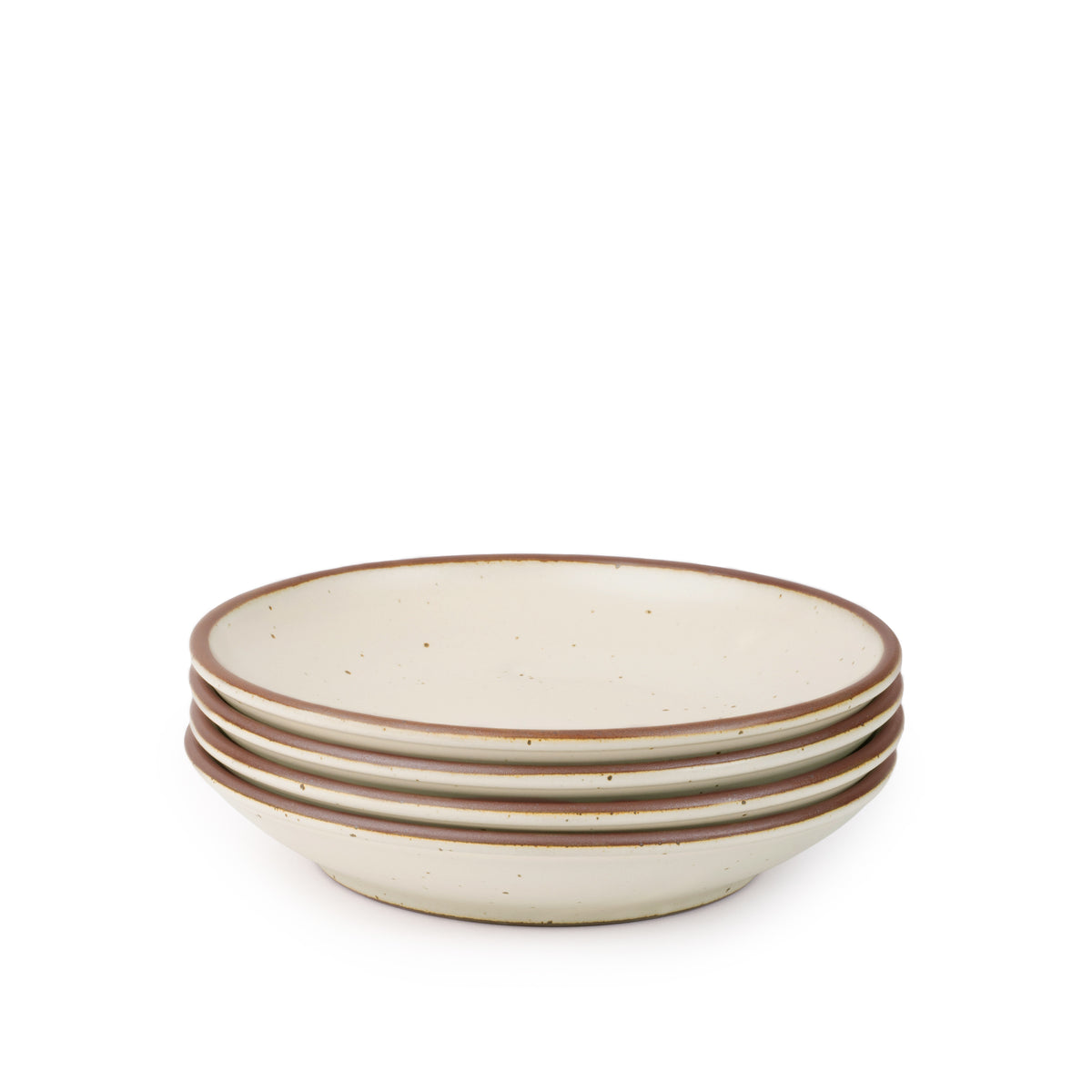 A stack of 4 medium ceramic plates with a curved bowl edge in a warm off-white color featuring iron speckles and an unglazed rim.