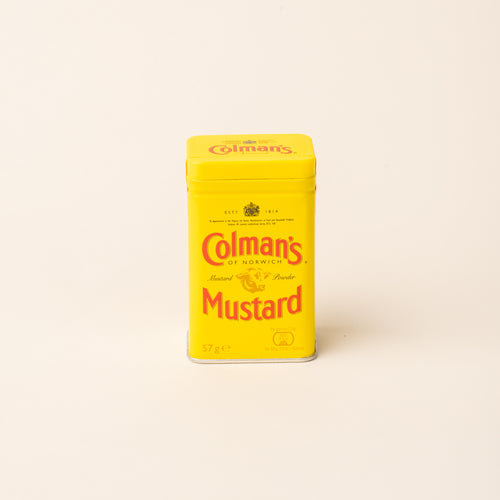 Colman's Mustard Powder tin on a plain white background.