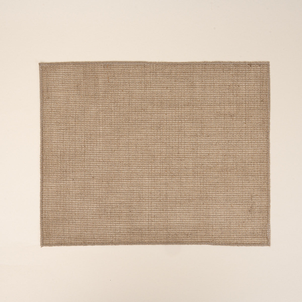 Textured woven placemat in a natural neutral color