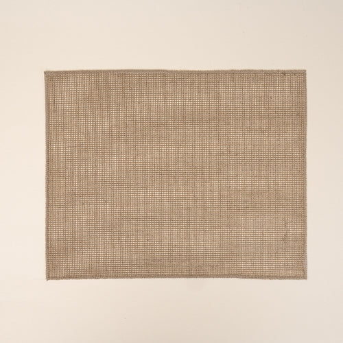 Textured woven placemat in a natural neutral color