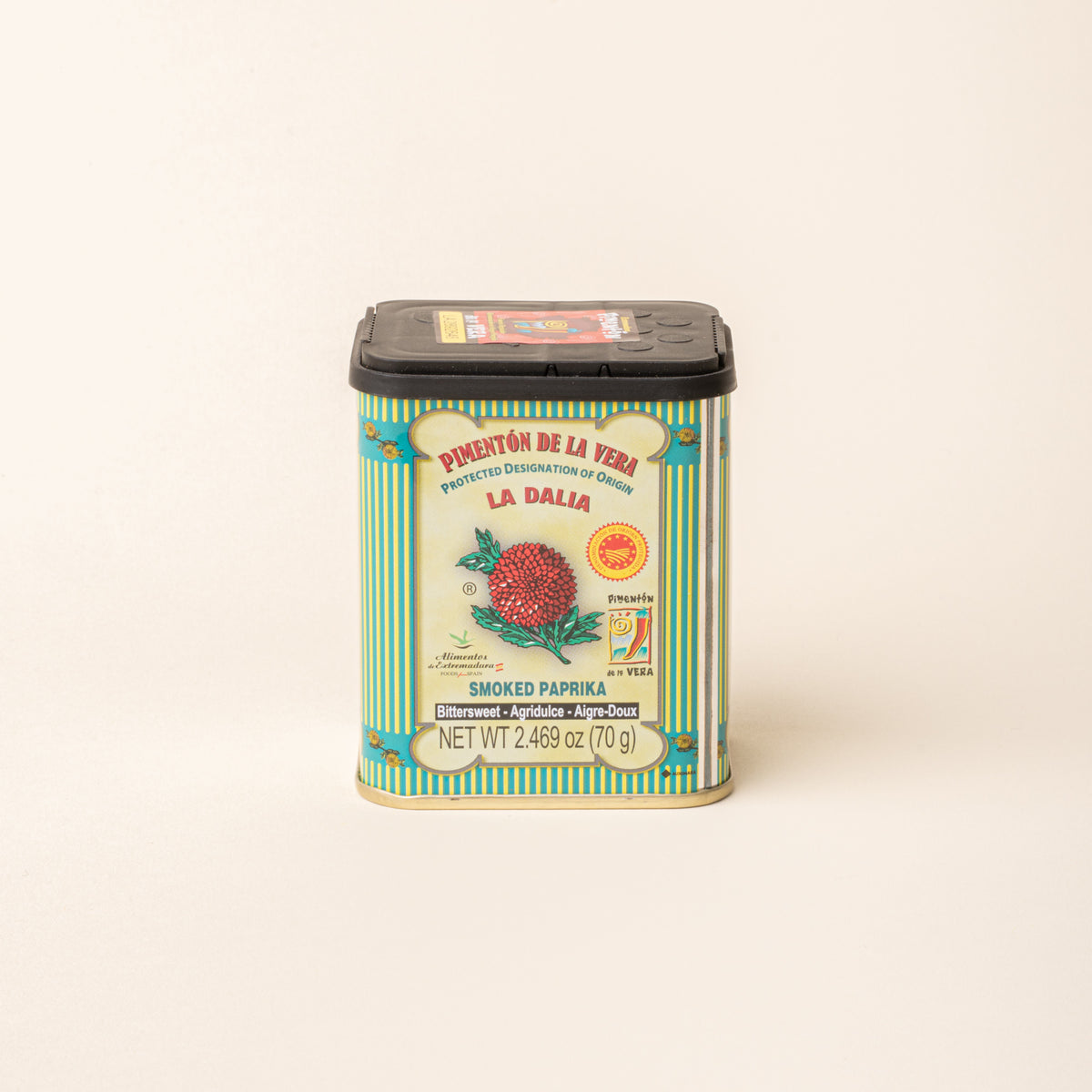 Tin of La Dalia smoked paprika with a black lid on a plain white background.