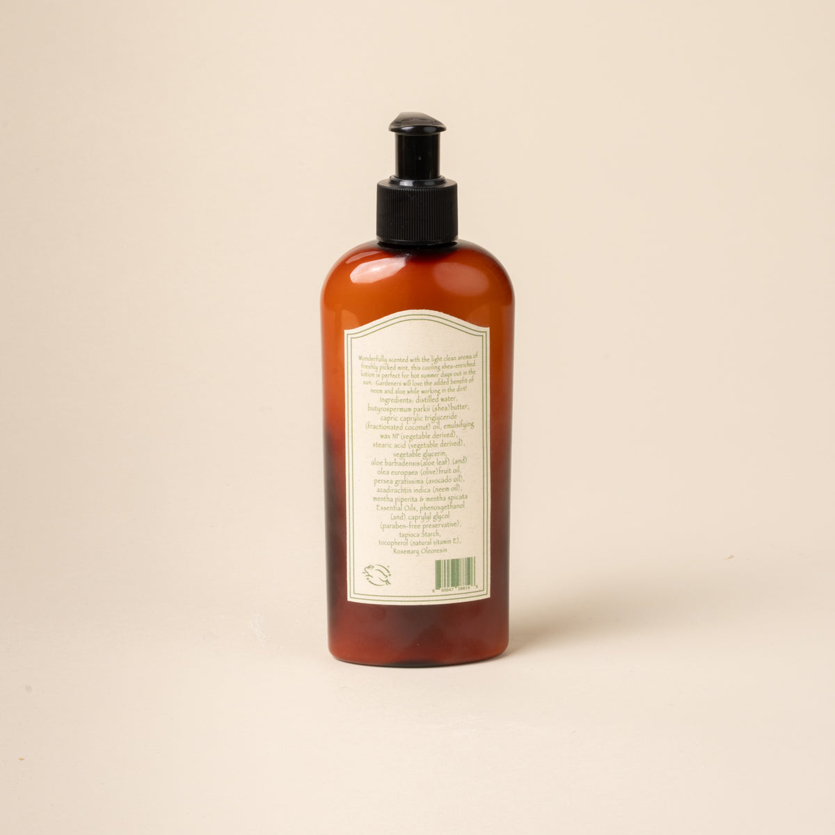 Brown bottle with pump and label on a beige background