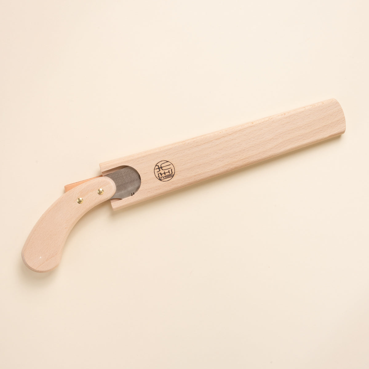 Wooden folding garden knife with curved handle, partially enclosed in a matching wooden sheath.