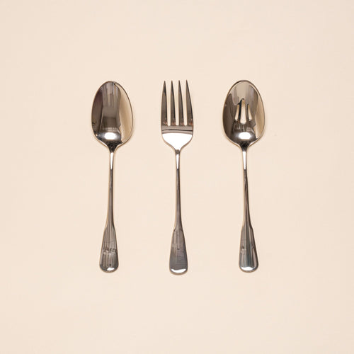 Three stainless steel serving utensils including a serving fork, serving spoon, and pierced spoon in a polished finish with a classic design