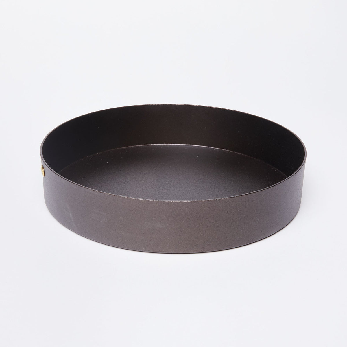 A round black metal cake pan