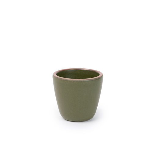 A short cup that tapers out to get wider at the top in an olive green color featuring iron speckles