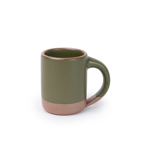 A medium sized ceramic mug with handle in an olive green color featuring iron speckles and unglazed rim and bottom base.