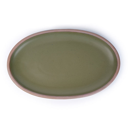A large oval ceramic platter in an olive green color featuring iron speckles and an unglazed rim