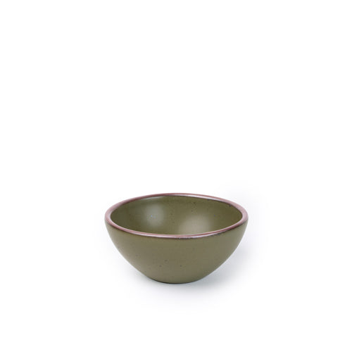 A small dessert sized rounded ceramic bowl in an olive green color featuring iron speckles and an unglazed rim