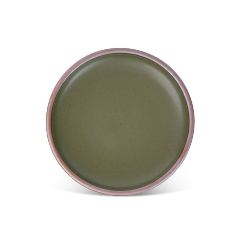 A dinner sized ceramic plate in an olive green color featuring iron speckles and an unglazed rim