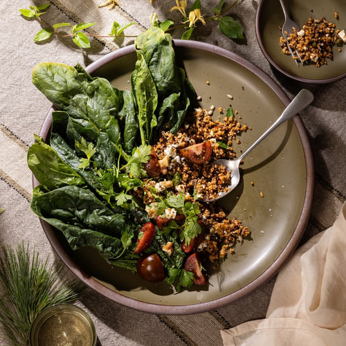 Olive-toned stoneware serving platter, styled with fresh greens, grains, and seasonal vegetables for everyday dining.