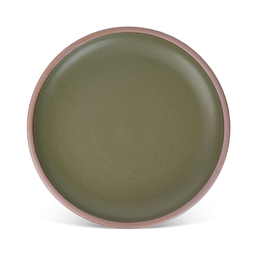 A large ceramic platter in an olive green color featuring iron speckles and an unglazed rim.
