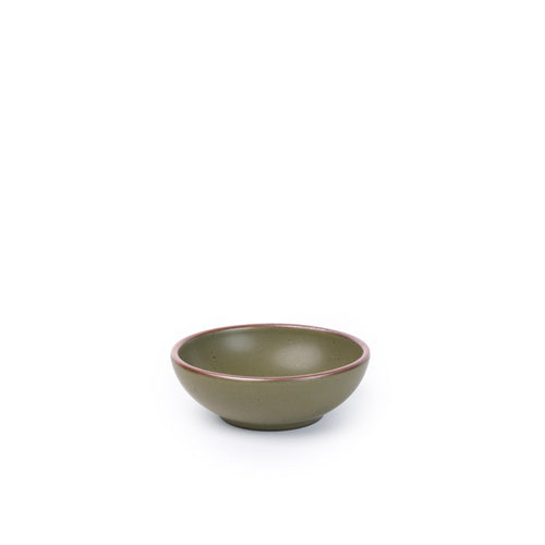 A small shallow ceramic bowl in an olive green color featuring iron speckles and an unglazed rim