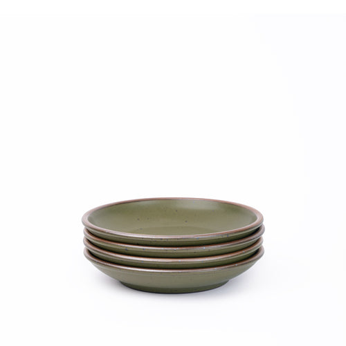 A stack of 4 small ceramic plates with a curved bowl edge in an olive green color featuring iron speckles and an unglazed rim.