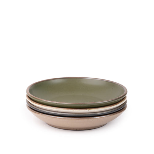 A stack of 4 medium ceramic plates with a curved bowl edge in an olive green, graphite black, off-white, and warm pale brown colors featuring iron speckles and an unglazed rim.