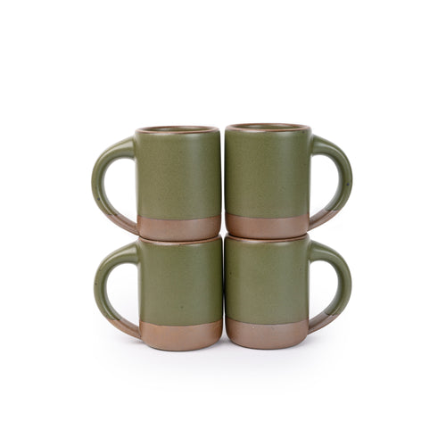 Four medium sized ceramic mugs with handles in an olive green color featuring iron speckles and unglazed rim and bottom base, stacked in sets of 2.