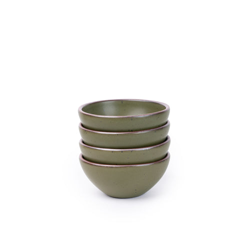 A stack of 4 small dessert sized rounded ceramic bowls in an olive green color featuring iron speckles and an unglazed rim
