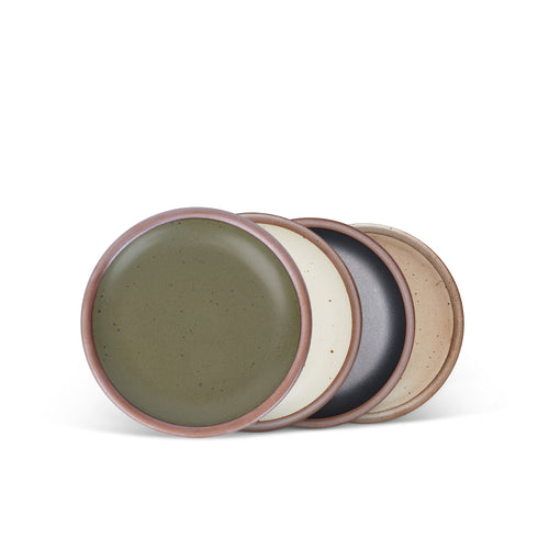 4 dessert sized ceramic plates in an olive green, warm off-white, graphite black and pale warm brown color featuring iron speckles and an unglazed rim.