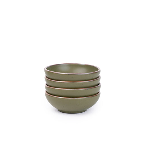 A stack of 4 small shallow ceramic bowls in an olive green color featuring iron speckles and an unglazed rim