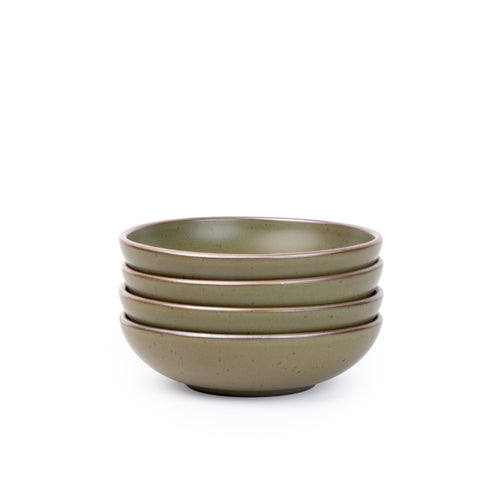 A stack of 4 dinner-sized shallow ceramic bowls in an olive green color featuring iron speckles and an unglazed rim