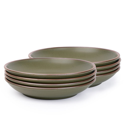 A stack of 8 large ceramic plates with a curved bowl edge in an olive green color featuring iron speckles and an unglazed rim.