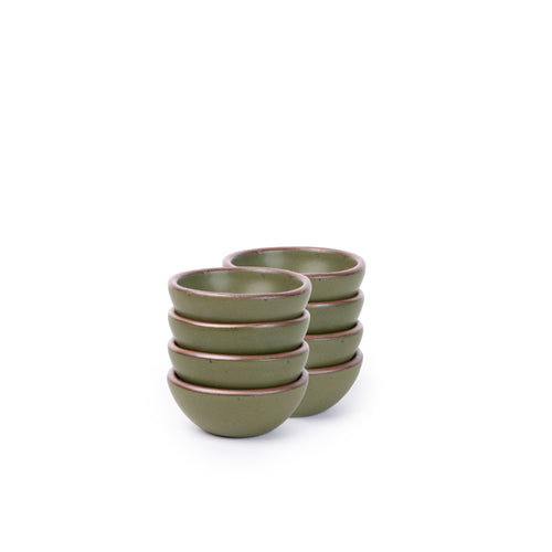 A stack of 8 tiny rounded ceramic bowls in an olive green color featuring iron speckles and an unglazed rim