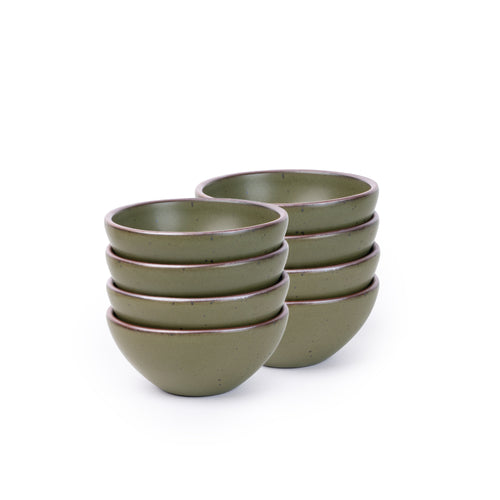 A stack of 8 small dessert sized rounded ceramic bowls in an olive green color featuring iron speckles and an unglazed rim