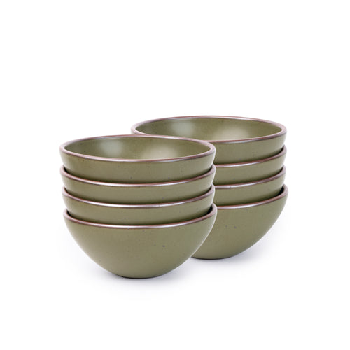 A stack of 8 medium rounded ceramic bowls in an olive green color featuring iron speckles and an unglazed rim