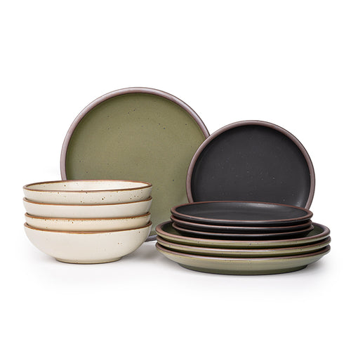 4 ceramic dinner plates in olive green, 4 side plates in graphite black, and 4 shallow dinner bowls in off-white with iron speckles and unglazed rims.