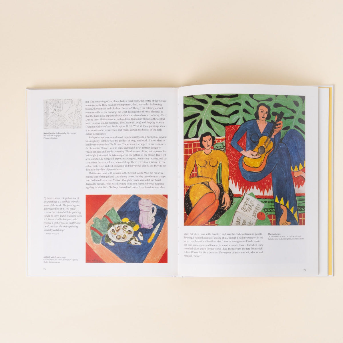 An open art book showing Henri Matisse’s painting The Music, depicting two women surrounded by bold colors and patterns, alongside accompanying text and smaller reproductions.