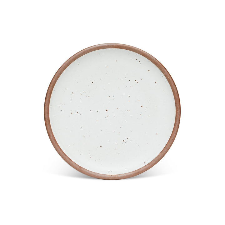 Round ceramic plate with a speckled white glaze and a natural brown rim, set against a white background.