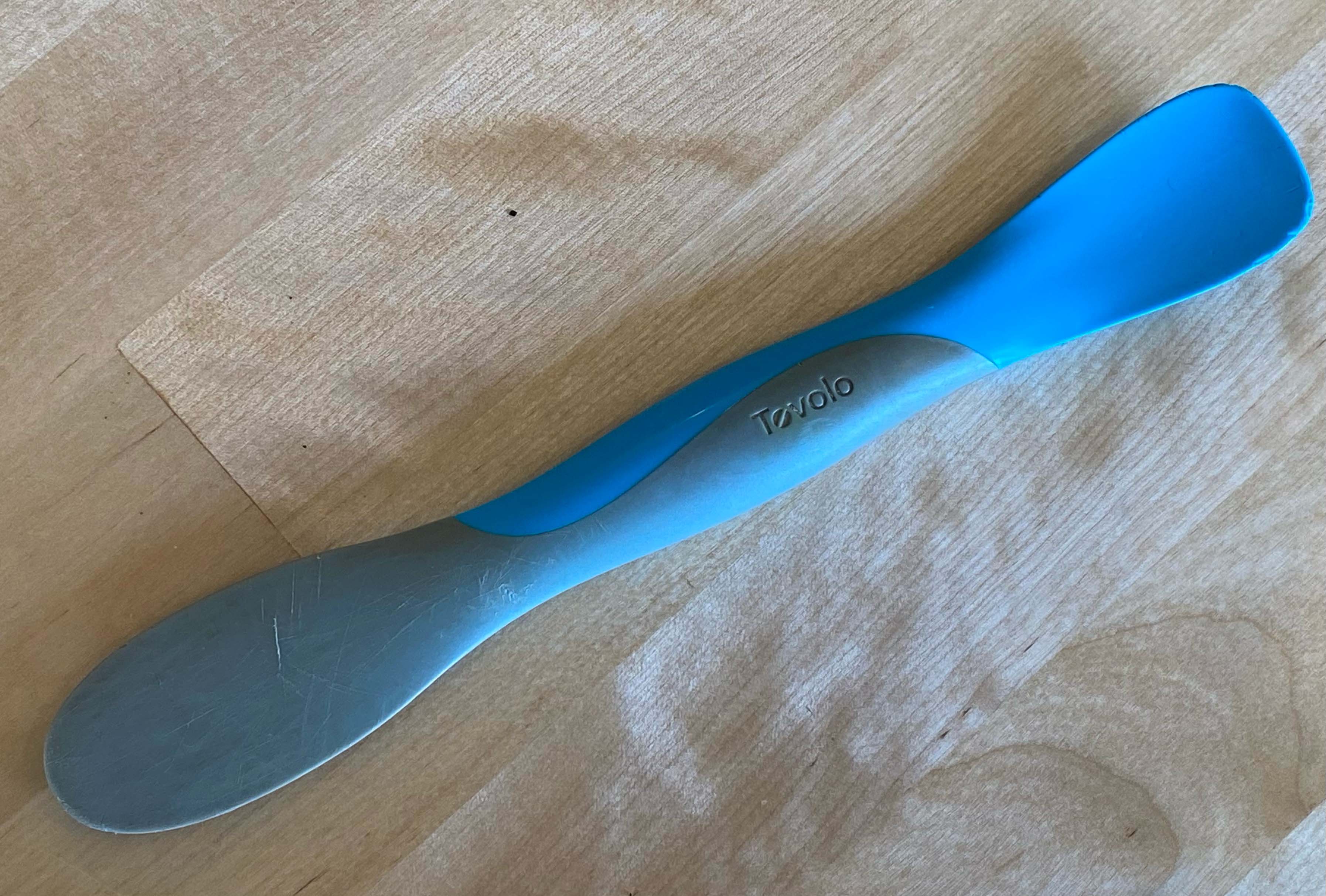 A blue Tovolo Spatula/Spreader