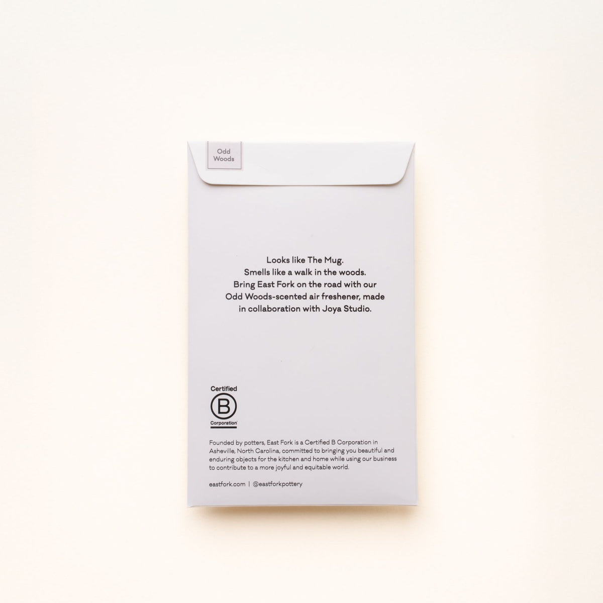 Back of East Fork “Odd Woods” air freshener packaging describing the scent and collaboration with Joya Studio, featuring Certified B Corporation details.