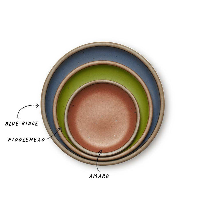 A stack of 3 plates in Dinner, Side, and Cake sizes in a cool, medium blue, fern green, and cool terracotta colors.