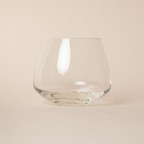 Clear glass whiskey snifter with a rounded base