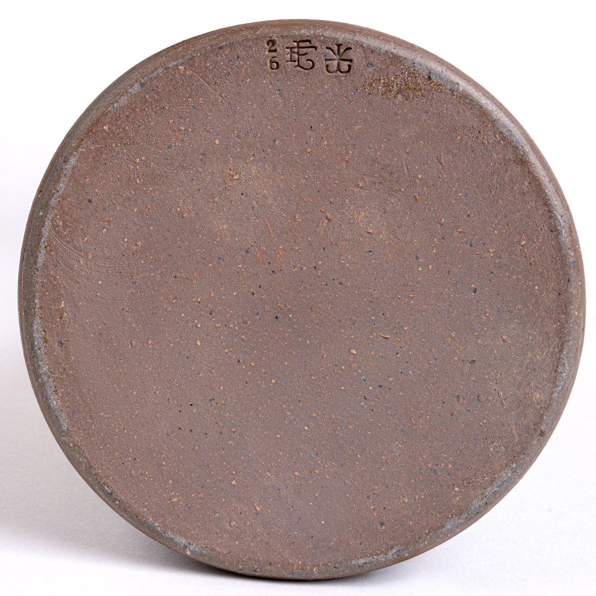 Bottom of a wheel thrown carafe with stamps that read '26' 'EF' and John Vigeland's stamp.