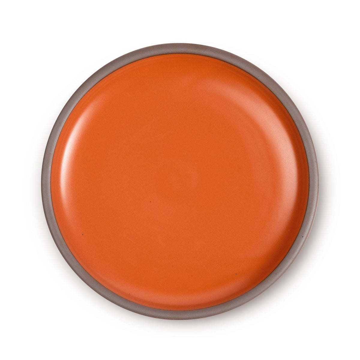 A large ceramic platter in a bold orange color featuring an unglazed rim.