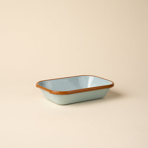 Small rectangular baking dish in a robin's egg blue color with a warm brown rim.