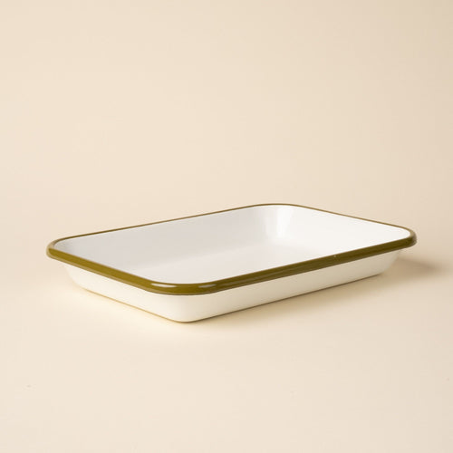 Large rectangular baking dish in a white color with an olive green rim.