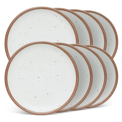 8 dinner sized ceramic plates in a cool white color featuring iron speckles and an unglazed rim
