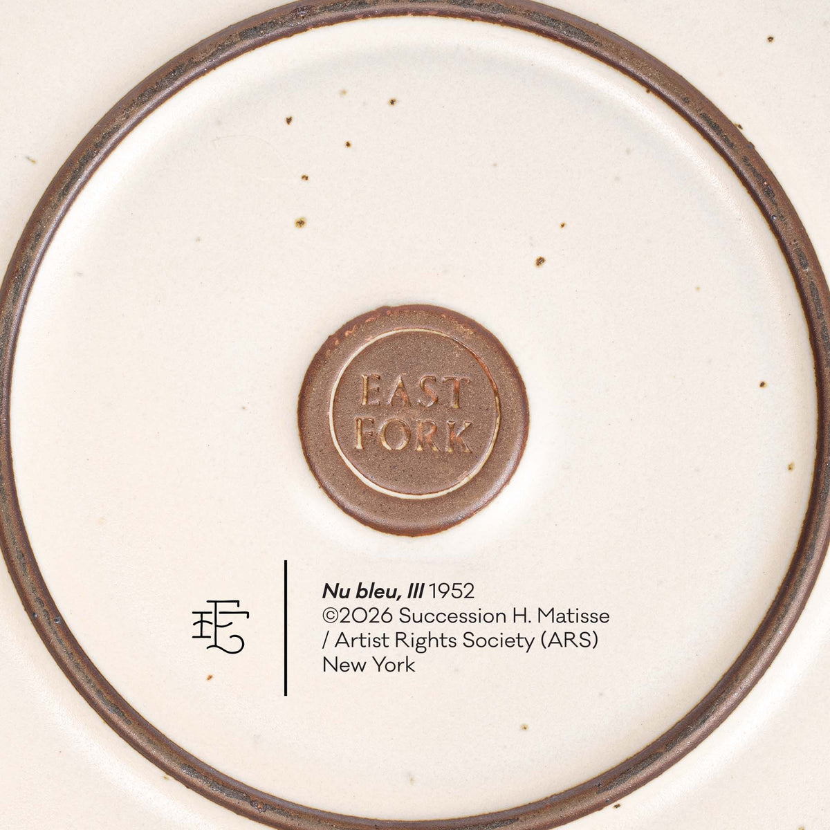 The back of the Dinner Platter with an East Fork stamp with a small decal of information about the artwork.