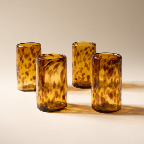 4 tortoiseshell tall transparent drinking glasses